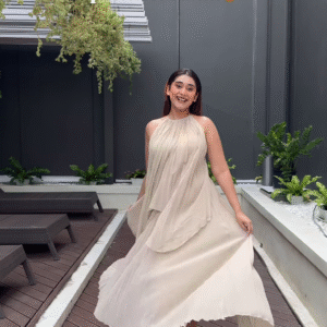 Elegant Flowing Beige Dress with Halter Neck – A Dreamy Day Look